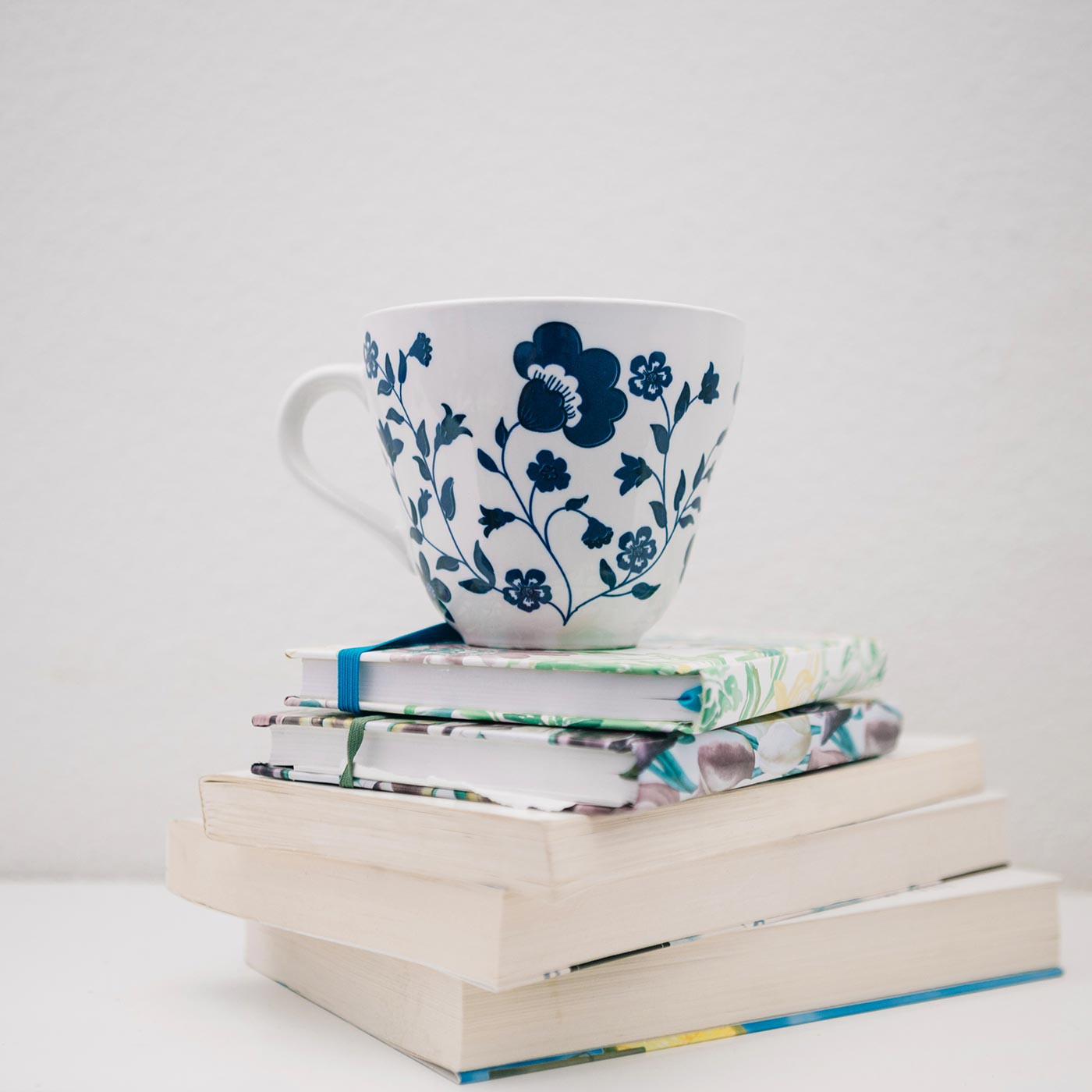 A cozy morning: steaming cup and open book await you
