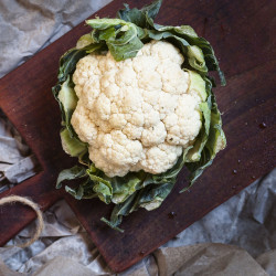 White cauliflower with green leaves